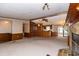 Open-concept living area with a fireplace, built-in shelving, and seamless flow to the kitchen at 835 South Marlin Circle, Murrells Inlet, SC 29576