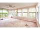 Bright sun room featuring lots of windows, a ceiling fan, and a sliding glass door at 835 South Marlin Circle, Murrells Inlet, SC 29576