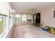 Bright sun room featuring lots of windows, a ceiling fan, and a sliding glass door at 835 South Marlin Circle, Murrells Inlet, SC 29576