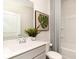 Well-appointed bathroom featuring a gray vanity, a tub with a shower and attractive decor at 882 Farmers Passage Loop, Loris, SC 29569
