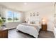 Comfortable main bedroom with a large window offering scenic views, complemented by stylish decor and soft lighting at 882 Farmers Passage Loop, Loris, SC 29569