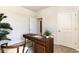 Bright office with a wooden desk, neutral walls, and a woven chair with a white cushion at 882 Farmers Passage Loop, Loris, SC 29569