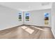 Sunlit bedroom with two large windows and a glass panel door illuminating the space at 977 Cherrystone Loop, Conway, SC 29526