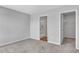 Comfortable bedroom with carpet, opening into an en-suite bathroom and walk-in closet at 977 Cherrystone Loop, Conway, SC 29526