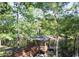 Charming gazebo overlooking a serene body of water, accessible by a wooden walkway with surrounding trees at 977 Cherrystone Loop, Conway, SC 29526