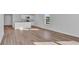 Bright, open-concept living room with modern kitchen featuring granite countertops and stainless steel appliances at 977 Cherrystone Loop, Conway, SC 29526
