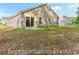 A spacious backyard with a patio and lush green grass, ideal for outdoor entertaining at 981 Cherrystone Loop, Conway, SC 29526