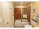 Bathroom with a white shower-tub combination and rust-colored tiled walls at 100 North Beach Blvd. # 1801, North Myrtle Beach, SC 29582