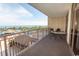 Balcony with furniture overlooking ocean, palm trees, and pool at 100 North Beach Blvd. # 313, North Myrtle Beach, SC 29582