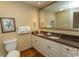 Bathroom featuring double sinks, granite countertop, and tile floor at 100 North Beach Blvd. # 313, North Myrtle Beach, SC 29582