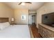 Comfortable bedroom with a king-size bed, dresser and an en-suite bathroom at 100 North Beach Blvd. # 313, North Myrtle Beach, SC 29582