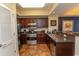 Modern kitchen with stainless steel appliances, granite countertops, and dark wood cabinets at 100 North Beach Blvd. # 313, North Myrtle Beach, SC 29582