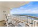 Scenic balcony with oceanfront views, beach access, and comfortable seating at 1012 N Waccamaw Dr. # 507, Murrells Inlet, SC 29576