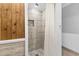 Shower stall featuring custom tile and stone floor at 1012 N Waccamaw Dr. # 507, Murrells Inlet, SC 29576