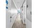 Bright hallway with tile floors leading to the living space with ocean views, enhancing the sense of arrival at 1012 N Waccamaw Dr. # 507, Murrells Inlet, SC 29576