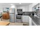 Well-equipped kitchen with stainless steel appliances and white cabinets at 1012 N Waccamaw Dr. # 507, Murrells Inlet, SC 29576