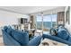 Cozy living room with ocean view balcony, comfortable seating, and stylish decor for relaxation and entertainment at 1012 N Waccamaw Dr. # 507, Murrells Inlet, SC 29576