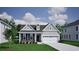 Charming single-Gathering home showcasing a well-manicured lawn, stone accents, and a two-car garage at 1091 Laconic Dr., Myrtle Beach, SC 29588