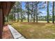 Picturesque view of the lush backyard, seamlessly merging with a golf course at 114 Laurelwood Ln., Conway, SC 29526