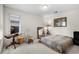 Bedroom with a leopard print bedspread, an area for a desk, and a large window at 114 Laurelwood Ln., Conway, SC 29526