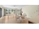 Bright dining area offering views with a table set for four, and access to the kitchen at 114 Laurelwood Ln., Conway, SC 29526