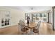 Light-filled dining area with table for four, a door and views at 114 Laurelwood Ln., Conway, SC 29526