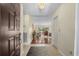 Bright entryway with tile flooring, leading to a living room with wood floors at 114 Laurelwood Ln., Conway, SC 29526