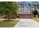 Charming one-story brick home with mature tree and manicured front yard at 114 Laurelwood Ln., Conway, SC 29526