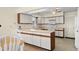 Well-lit kitchen equipped with white appliances, lots of cabinet storage, and eat-in dining area at 114 Laurelwood Ln., Conway, SC 29526
