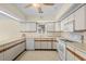 Bright kitchen with appliances, ample counter space, neutral cabinets, and overhead lighting at 114 Laurelwood Ln., Conway, SC 29526