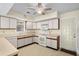 Open kitchen with white appliances, neutral cabinets, and good natural light at 114 Laurelwood Ln., Conway, SC 29526