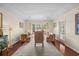 Bright living room with wood floors, neutral walls, and large windows overlooking the yard at 114 Laurelwood Ln., Conway, SC 29526