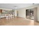 Open-concept living and dining area with sliding glass doors and kitchen access at 114 Laurelwood Ln., Conway, SC 29526