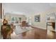 Cozy living room featuring wood floors and sliding glass doors to the outside patio at 114 Laurelwood Ln., Conway, SC 29526