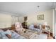 Inviting living room with plush seating, wood floors, and ample natural light at 114 Laurelwood Ln., Conway, SC 29526