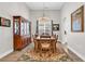 Bright dining room with hardwood floors, traditional furniture, chandelier and large china cabinet at 1151 N Blackmoor Dr., Murrells Inlet, SC 29576