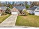 Charming brick home featuring a well-manicured lawn and a two-car garage at 1151 N Blackmoor Dr., Murrells Inlet, SC 29576