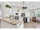 Spacious kitchen featuring a large island with marble countertops, stainless steel appliances, and a wine fridge at 1151 N Blackmoor Dr., Murrells Inlet, SC 29576