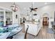 Open-concept kitchen with white cabinetry, a large island, and views of the living room and dining area at 1151 N Blackmoor Dr., Murrells Inlet, SC 29576
