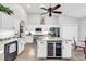 Bright kitchen featuring a large island with a marble countertop, stainless appliances, and a wine fridge at 1151 N Blackmoor Dr., Murrells Inlet, SC 29576