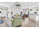 Bright, open-concept living room with hardwood floors, comfortable seating and view of the dining room and kitchen at 1151 N Blackmoor Dr., Murrells Inlet, SC 29576