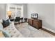Office space with hardwood floors, a comfortable sofa, workspace and TV with nature scenes at 1151 N Blackmoor Dr., Murrells Inlet, SC 29576