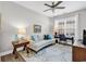 Cozy home office with natural light, a comfortable sofa and workspace with desk at 1151 N Blackmoor Dr., Murrells Inlet, SC 29576
