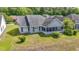 A peaceful screened-in porch and well-maintained backyard of a single Gathering house at 121 Ashworth Dr., Little River, SC 29566
