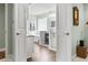 Bright, elegant bathroom featuring double doors, modern fixtures, and a relaxing soaking tub at 121 Ashworth Dr., Little River, SC 29566