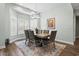 Well-lit dining room with plantation shutters and chandelier, ideal for Gathering meals and entertaining guests at 121 Ashworth Dr., Little River, SC 29566