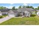 Beautiful single-story house boasts an attached garage, manicured lawn, and scenic water feature in a desirable community at 121 Ashworth Dr., Little River, SC 29566