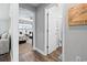 Hallway view into a bedroom and a bathroom at 121 Ashworth Dr., Little River, SC 29566