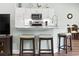 Kitchen bar featuring modern stools, stainless steel appliances, and plenty of cabinet space at 121 Ashworth Dr., Little River, SC 29566