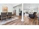 Open-concept living and dining area with hardwood floors, neutral paint, and lots of space for Gathering gatherings at 121 Ashworth Dr., Little River, SC 29566
